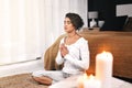 Woman, namaste and meditation exercise in home bedroom for peace, mental health and calm chakra. Female person with