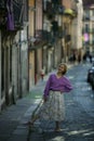 A woman on a narrow street in downtown Porto, Portugal. Royalty Free Stock Photo