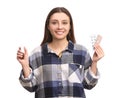 Woman with nasal spray and pills on white background