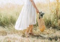 woman natural clothes eco mesh string bag wildflowers Royalty Free Stock Photo