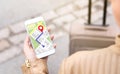 Woman navigating with mobile phone map application. Royalty Free Stock Photo