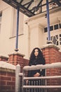 Woman near brick wall and entrance door Royalty Free Stock Photo