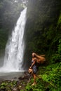 Woman near Nung Nung waterfal on Bali, Indonesia Royalty Free Stock Photo