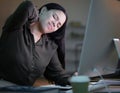 Woman with neck pain, working at night in office with computer and mental health of corporate business worker. Young Royalty Free Stock Photo