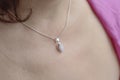 woman neckline wearing apatite mineral stone pendant on silver chain