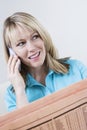 Woman With Newspaper On Call