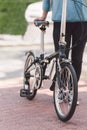 Woman next to a bicycle in the street Royalty Free Stock Photo