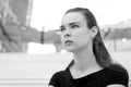 Woman with no makeup face in paris, france. Woman with long hair on blurred cityscape. Girl with young look and sensual