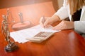 Woman Notary Public signing the notary acti n her office Royalty Free Stock Photo