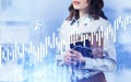 Woman with notebooks in office, financial chart