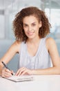 Woman, notepad and writing in office, portrait and smile for note taking, employee and job. Assistant, sitting and happy Royalty Free Stock Photo