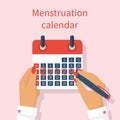 Woman notes in the calendar menstrual cycle