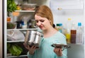 Woman noticed foul smell of food from casserole Royalty Free Stock Photo