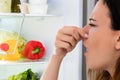 Woman Noticed Smell In Front Of Refrigerator