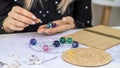 Woman numerologist astrologer counts numbers. Selective focus