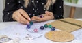 Woman numerologist astrologer counts numbers. Selective focus