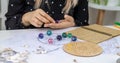 Woman numerologist astrologer counts numbers. Selective focus