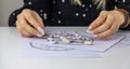 Woman numerologist astrologer counts numbers. Selective focus