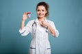 Woman nurse showing pills and thumb up isolated Royalty Free Stock Photo