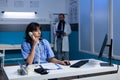 Woman nurse in uniform using landline phone for conversation Royalty Free Stock Photo