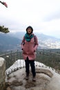 Woman on observation deck of silver gazebo