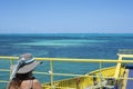 Woman observes the ocean from a ship Royalty Free Stock Photo