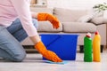 Woman with obsessive compulsive disorder cleaning floor Royalty Free Stock Photo