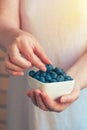 Woman offering blueberries Royalty Free Stock Photo