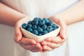 Woman offering blueberries Royalty Free Stock Photo