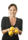 Woman offering fresh lemons