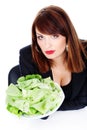Woman offering green salad