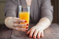 Woman offering orange juice