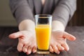 Woman offering orange juice