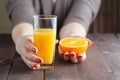 Woman offering orange juice