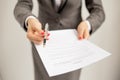 Woman offering to sign papers