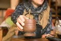 Woman offering yerba mate drink