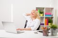 Woman in the office daydreaming Royalty Free Stock Photo