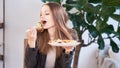 Woman in office eating salad at working place. Concept of lunch at work and eating healthy food. healthy eating concept Royalty Free Stock Photo