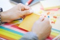 Woman at office holding adhesive note