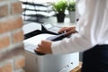 Woman in office prints documents on printer Royalty Free Stock Photo