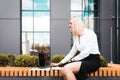 Office worker working on a laptop outdoor