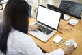 Woman office worker working with computer laptop at her office desk. Royalty Free Stock Photo