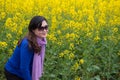 Woman and oilseed flower Royalty Free Stock Photo