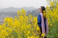 Woman and oilseed flower Royalty Free Stock Photo