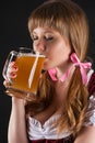 Woman Oktoberfest drinks beer