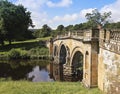 A Woman on an Old Bridge in England Royalty Free Stock Photo