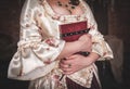 Woman in old historic medieval dress with book Royalty Free Stock Photo