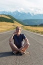 Woman om the Chuysky trakt road in the Altai mountains. Royalty Free Stock Photo