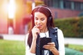 Woman online flirt and listening music outdoor