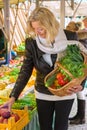 Woman at open air market picking vegetables Royalty Free Stock Photo